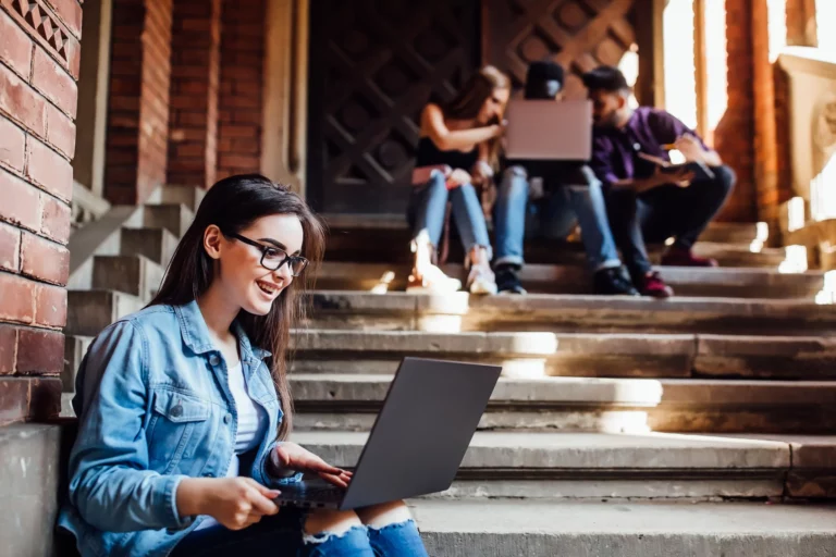 college-girl-working-with-laptop-after-lessons_11zon